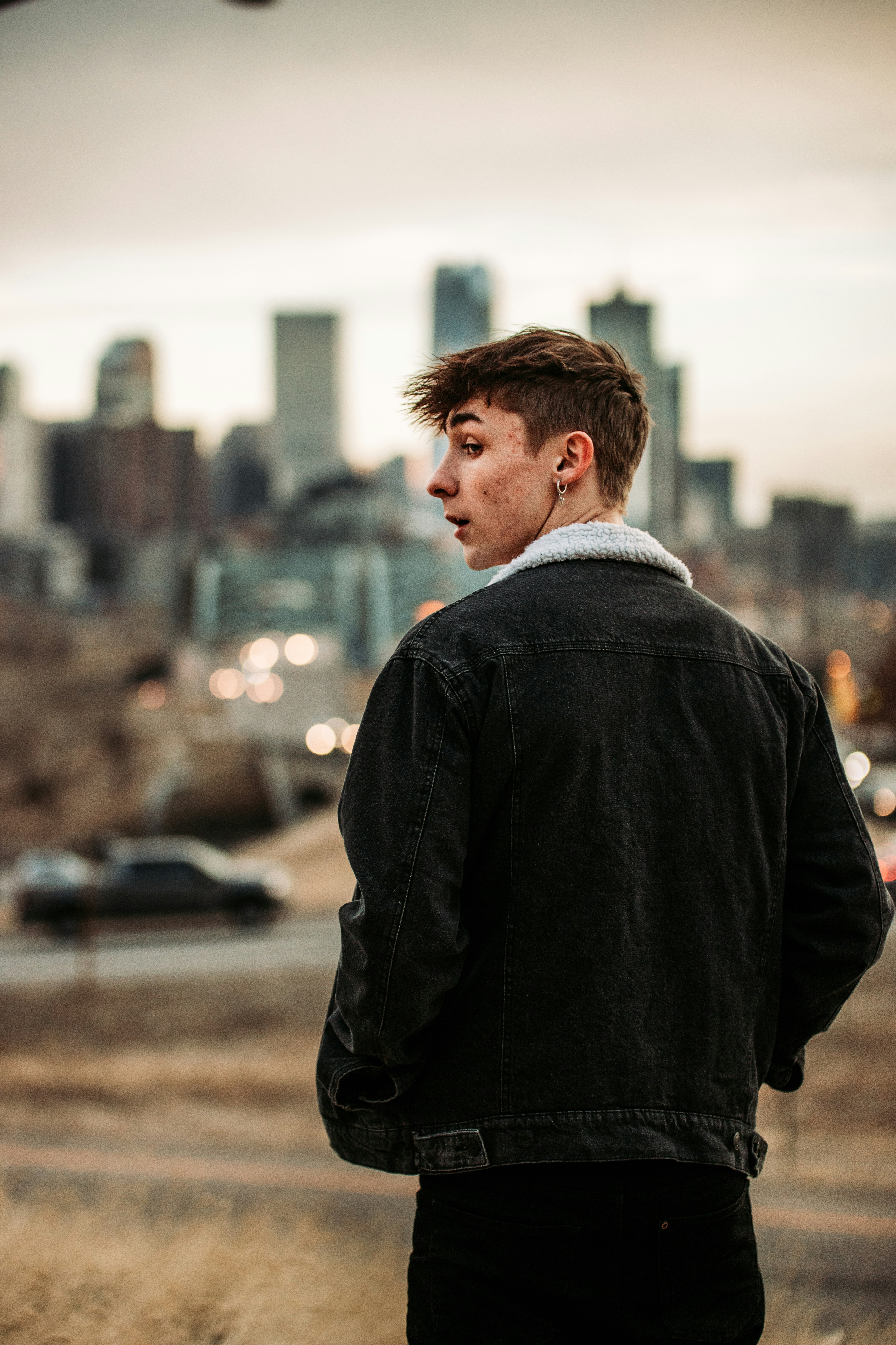 man in black coat standing during daytime